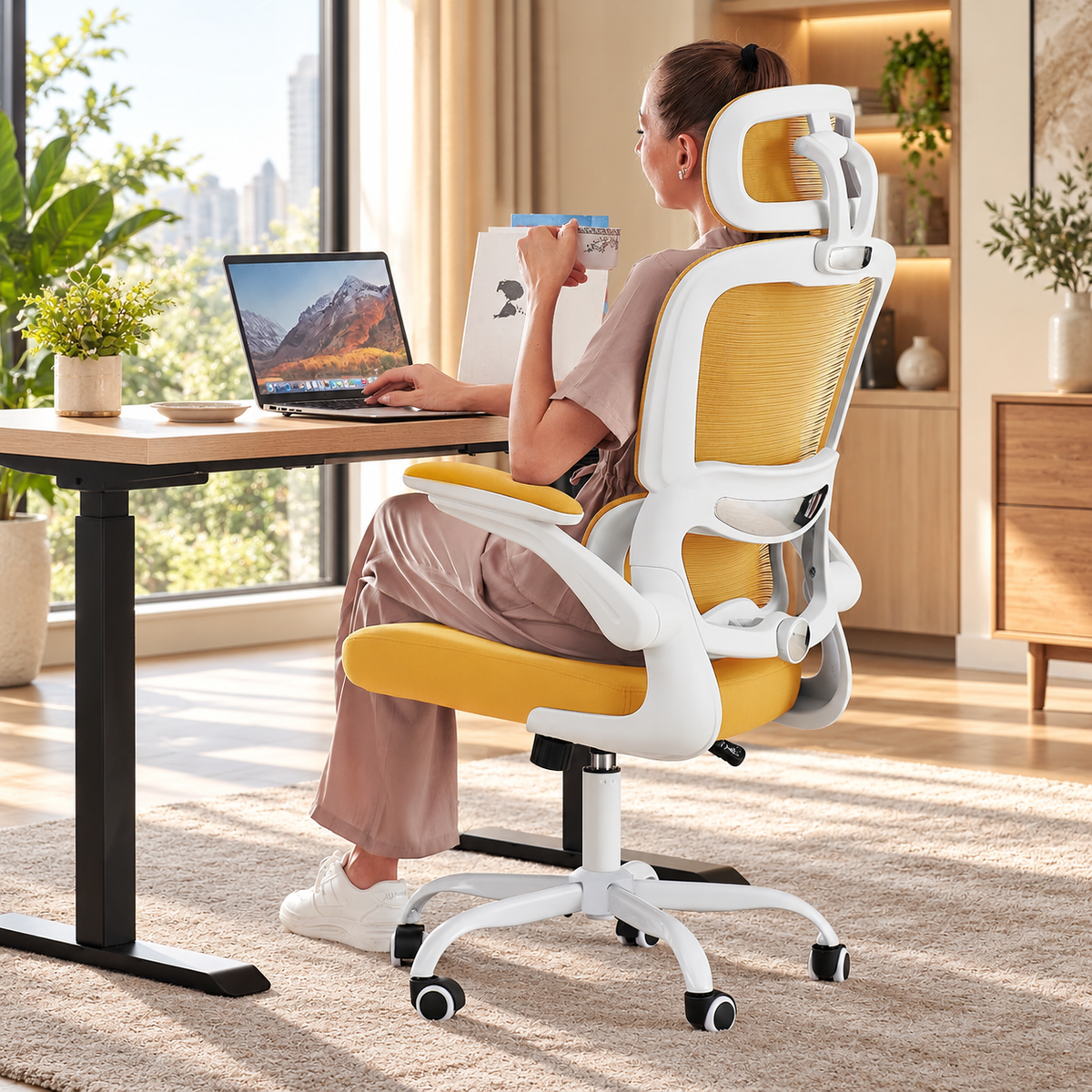 Yellow compact mesh ergonomic chair with white frame, headrest and flip-up arms