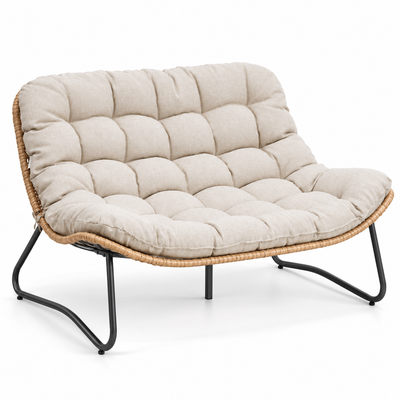 Boho outdoor loveseat with natural all-weather rattan seat, black metal legs and plush beige tufted cushion
