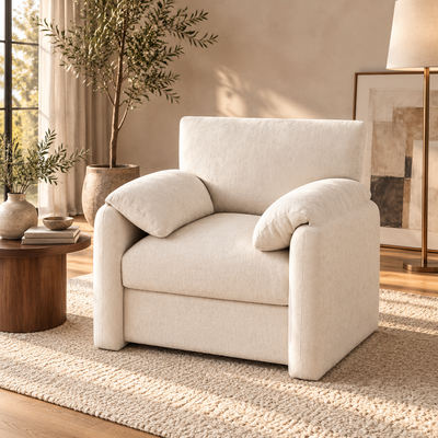 Extra-wide cream accent armchair with rounded arms in a bright living room