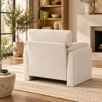 Rear view of the cream chenille oversized armchair showing its finished back