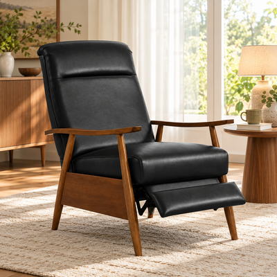 Black faux leather push-back recliner armchair with solid wood frame and footrest extended in a living room