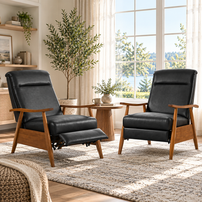 Two black recliner armchairs, one reclined and one upright, in a bright living room